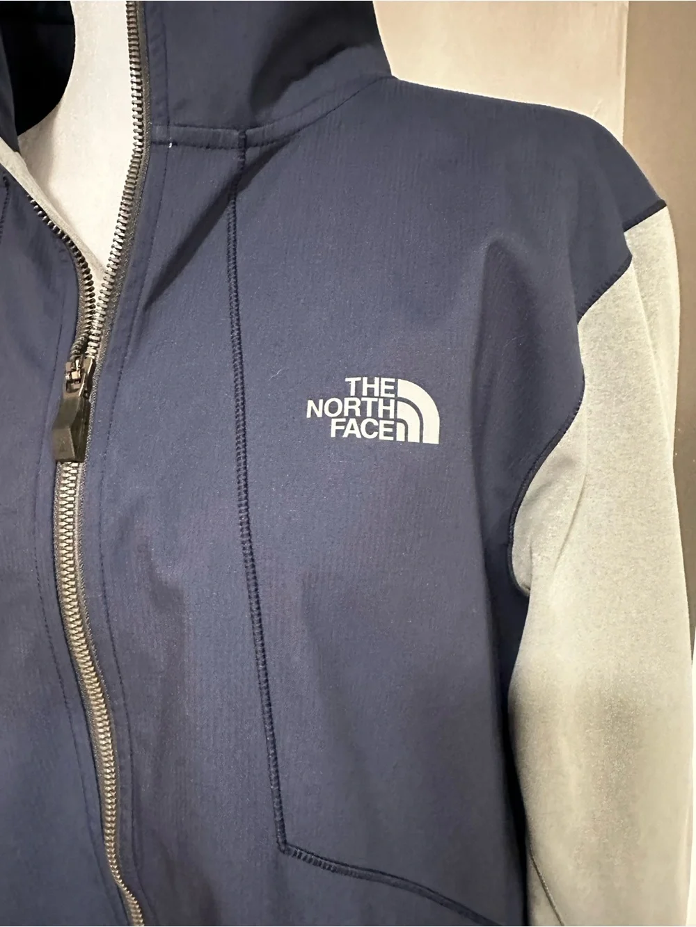 The North Face Navy with Light Gray Sleeve Softshell Jacket. Size L.